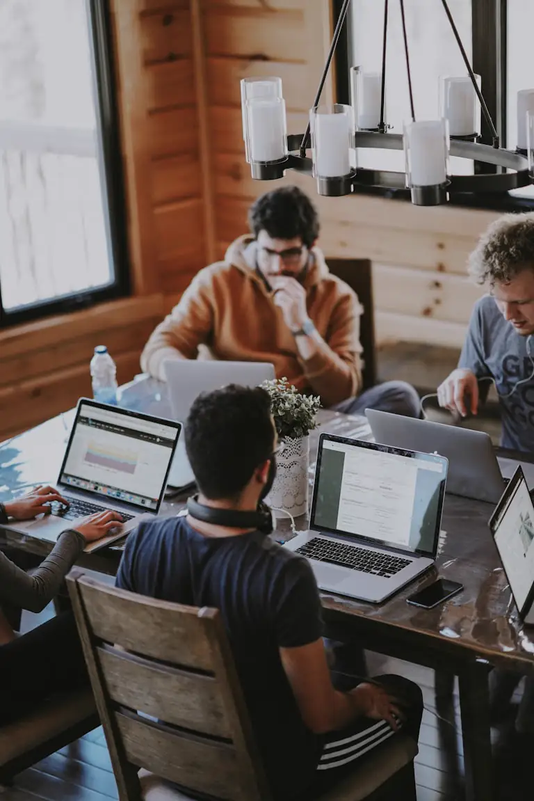 Senior consultants discussing strategy in a modern office